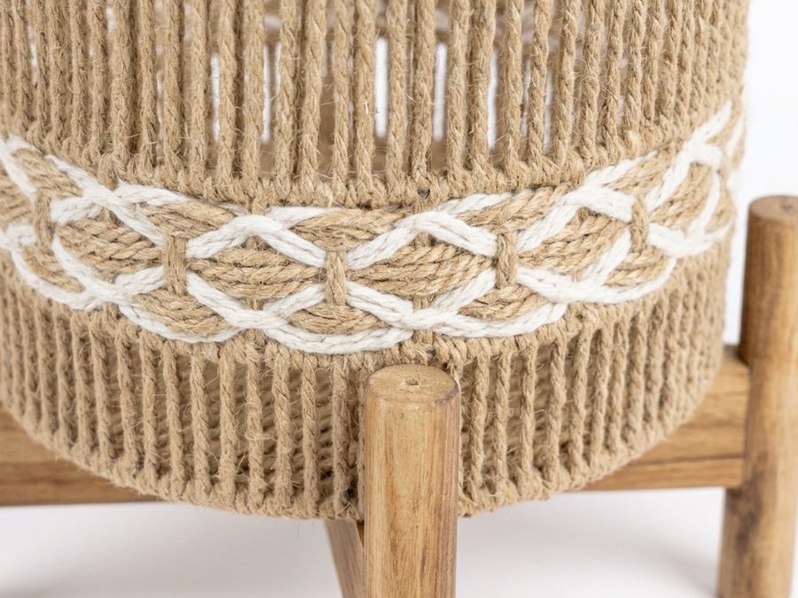 A close view of woven jute rope on a rattan pot holder with a wooden leg